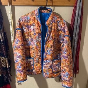 Vibrant Floral Quilted Jacket with Blue Edging